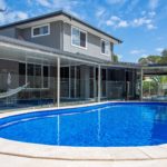 Bribie Island pool with crystal clear sky blue water built by Turul Builders