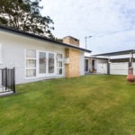 Stafford Property Build Renovation Neatly Trimmed Lawn at the Back of House