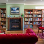 Burpengary Private Library Build Fireplace with Couch and Bookshelves