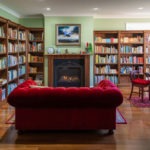 Burpengary Private Library Build - Bookshelves with Fireplace and Couch