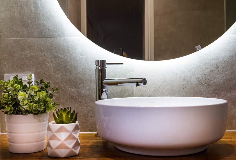Bathroom renovations Brisbane wide with Turul - Bathroom Builders Brisbane homeowners love and trust: A modern vanity with an elegant hand basin and a round mirror