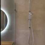 A close up of a dual shower head with heads in two sizes installed at a recently completed bathroom renovation by Turul Building Services