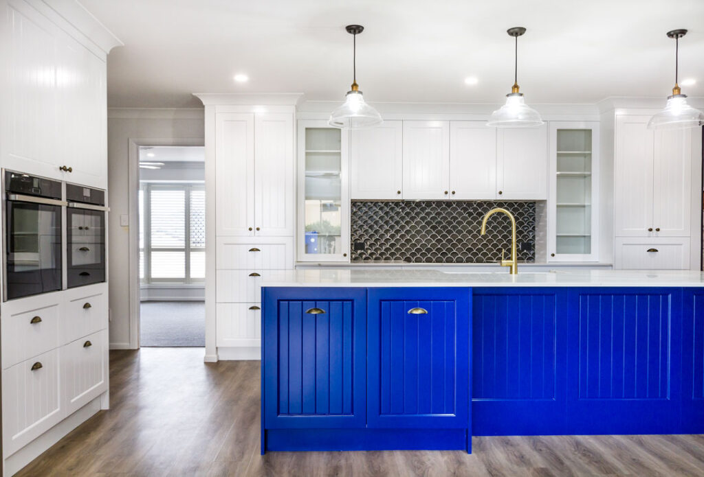 Queenslander style kitchen, newly renovated with blue kitchen cabinetry and matching high end hardware