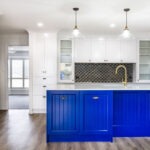 Queenslander style kitchen, newly renovated with blue kitchen cabinetry and matching high end hardware
