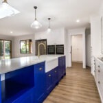 Queenslander style kitchen with blue cabinetry